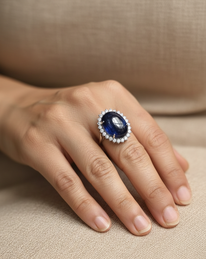 18K white gold oval blue sapphire ring with diamond halo, high-carat sapphire statement ring by Emirates Diamonds