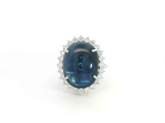 18K white gold oval blue sapphire ring with diamond halo, high-carat sapphire statement ring by Emirates Diamonds