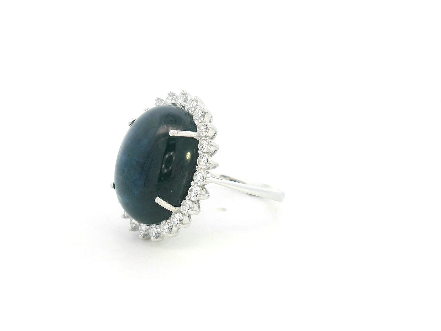 18K white gold oval blue sapphire ring with diamond halo, high-carat sapphire statement ring by Emirates Diamonds