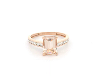 Emerald-cut morganite and diamond ring in 18K rose gold with 1.41 carat morganite and diamond band by Emirates Diamonds.