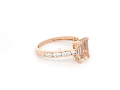 Emerald-cut morganite and diamond ring in 18K rose gold with 1.41 carat morganite and diamond band by Emirates Diamonds.