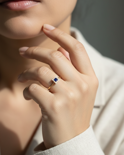 18K yellow gold square blue sapphire ring with diamond halo by Emirates Diamonds