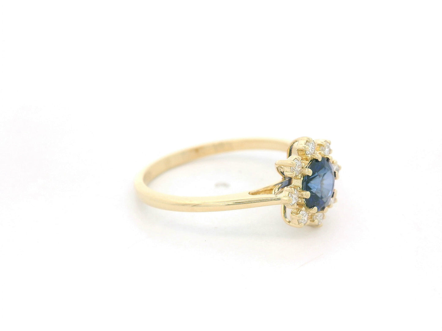 18K yellow gold blue sapphire ring with starburst-style diamond accents, sapphire weight 0.70 carat and total diamond weight 0.14 carat – Emirates Diamonds
