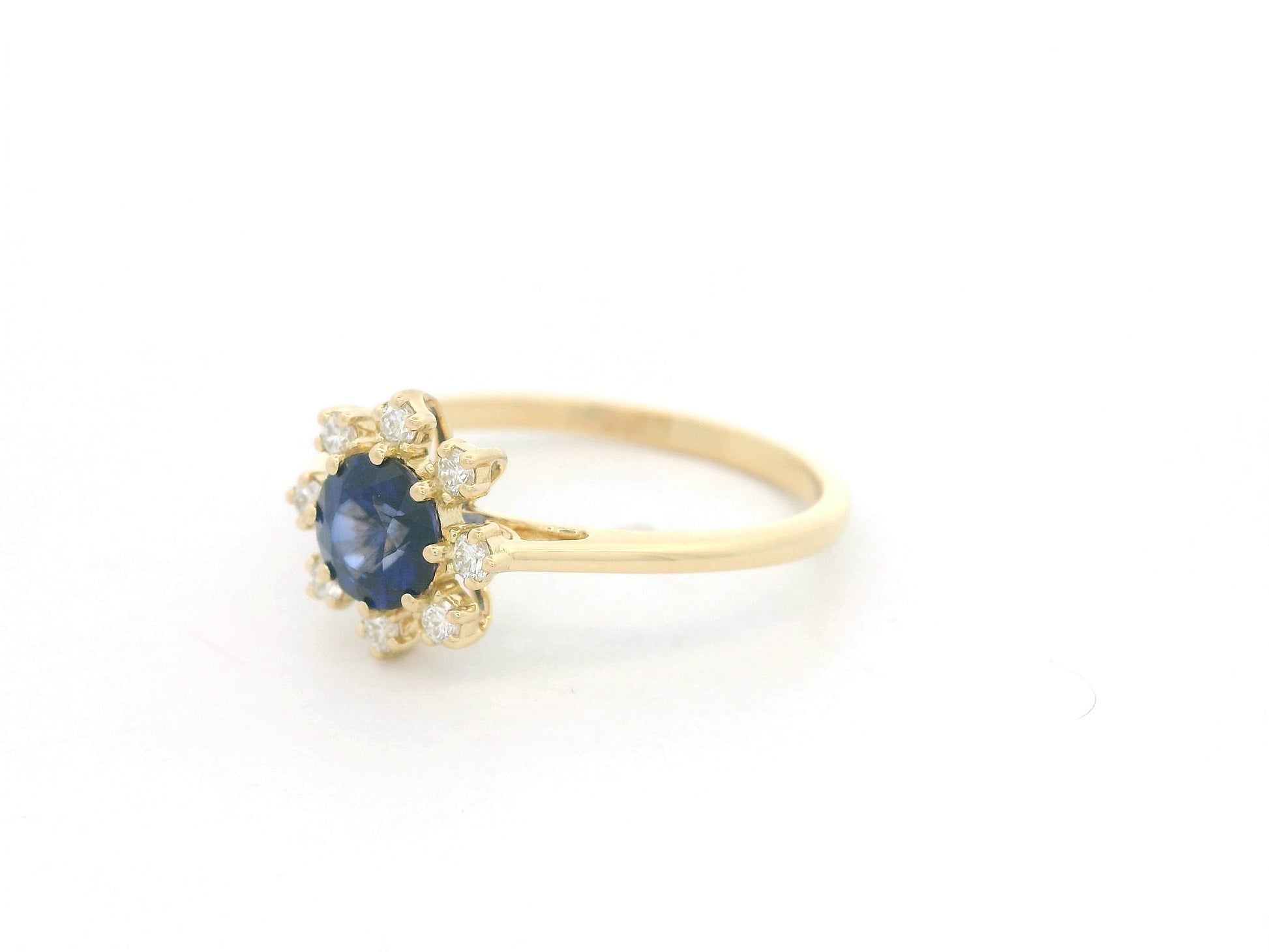 18K yellow gold blue sapphire ring with starburst-style diamond accents, sapphire weight 0.70 carat and total diamond weight 0.14 carat – Emirates Diamonds
