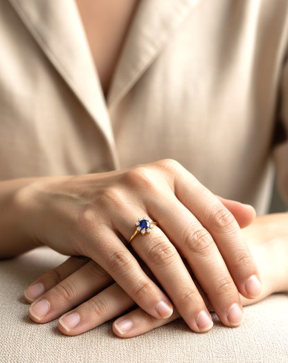 18K yellow gold blue sapphire ring with starburst-style diamond accents, sapphire weight 0.70 carat and total diamond weight 0.14 carat – Emirates Diamonds