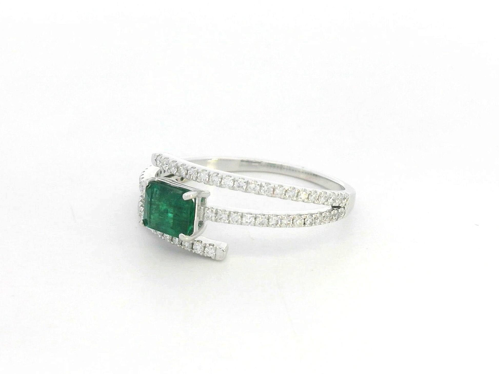 18K white gold emerald and diamond open wrap ring with square emerald center and pavé bands