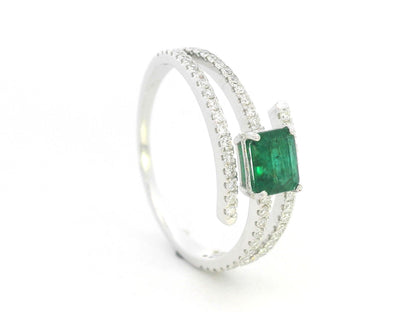 18K white gold emerald and diamond open wrap ring with square emerald center and pavé bands