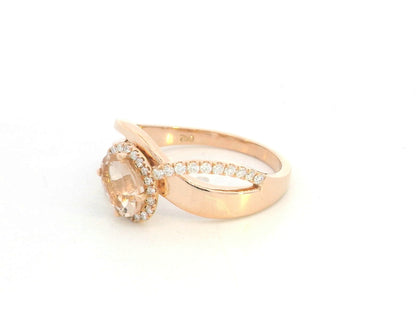 Morganite diamond halo wrap ring in 18K rose gold with oval morganite and diamond accents