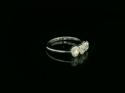 Diamond trilogy halo ring in 18K white gold with three round diamond clusters