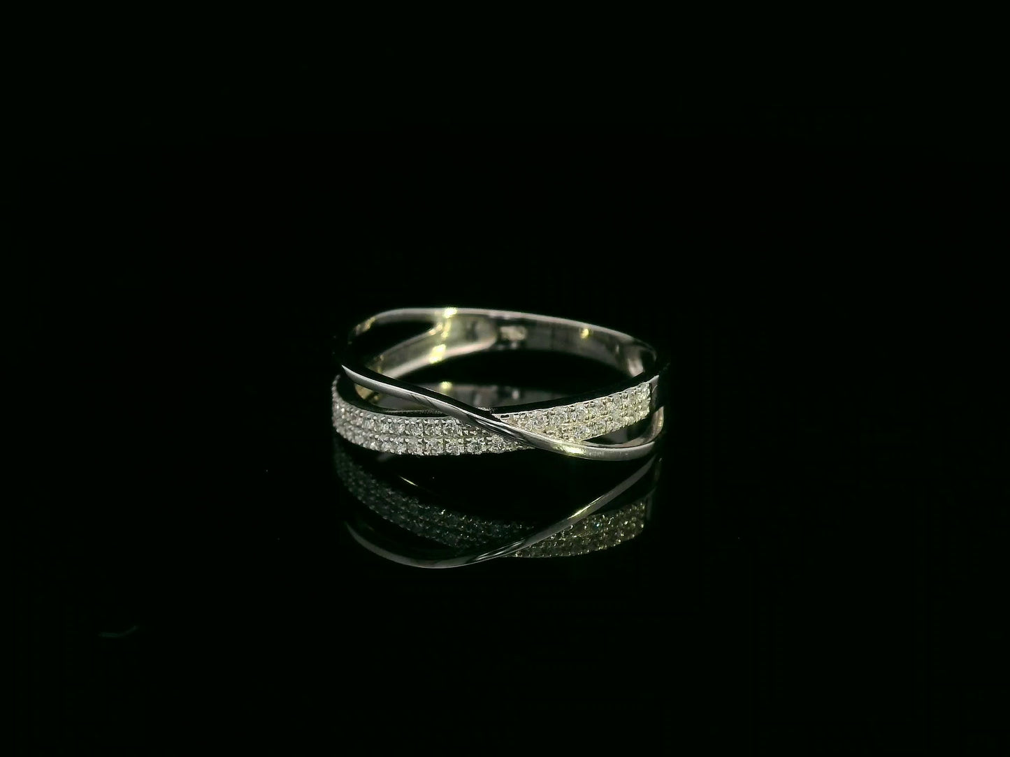 18K white gold diamond crossover ring featuring 0.20 carats of diamonds by Emirates Diamonds