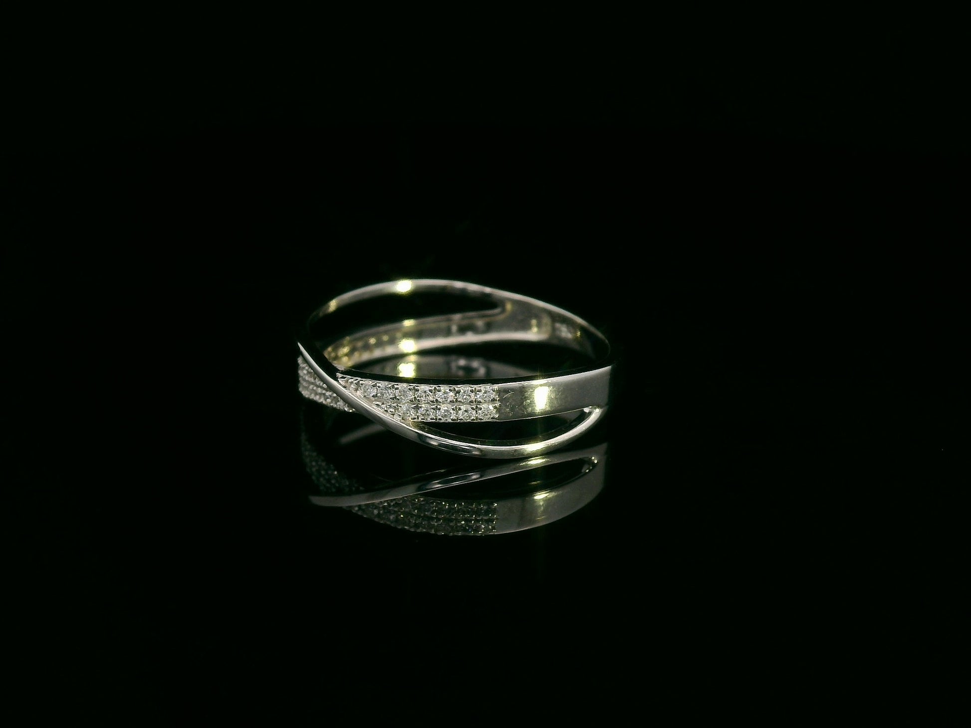 18K white gold diamond crossover ring featuring 0.20 carats of diamonds by Emirates Diamonds