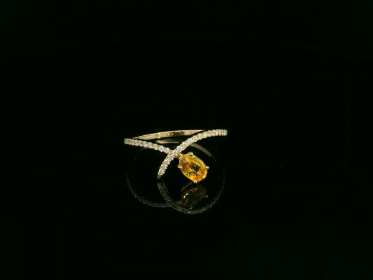 18K yellow gold oval yellow sapphire and diamond bypass statement ring by Emirates Diamonds