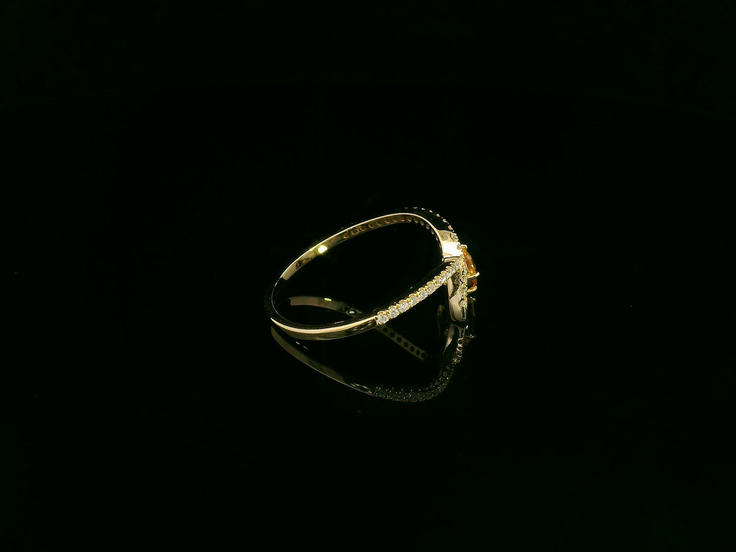 18K yellow gold oval yellow sapphire and diamond bypass statement ring by Emirates Diamonds