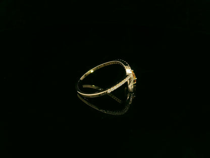 18K yellow gold oval yellow sapphire and diamond bypass statement ring by Emirates Diamonds