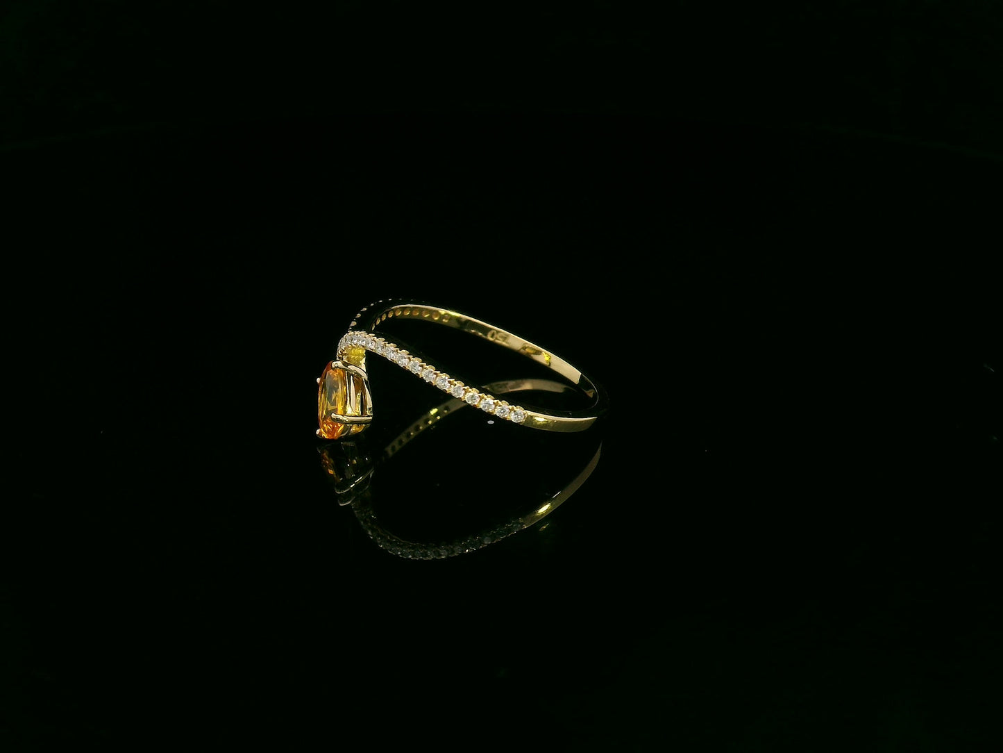 18K yellow gold oval yellow sapphire and diamond bypass statement ring by Emirates Diamonds