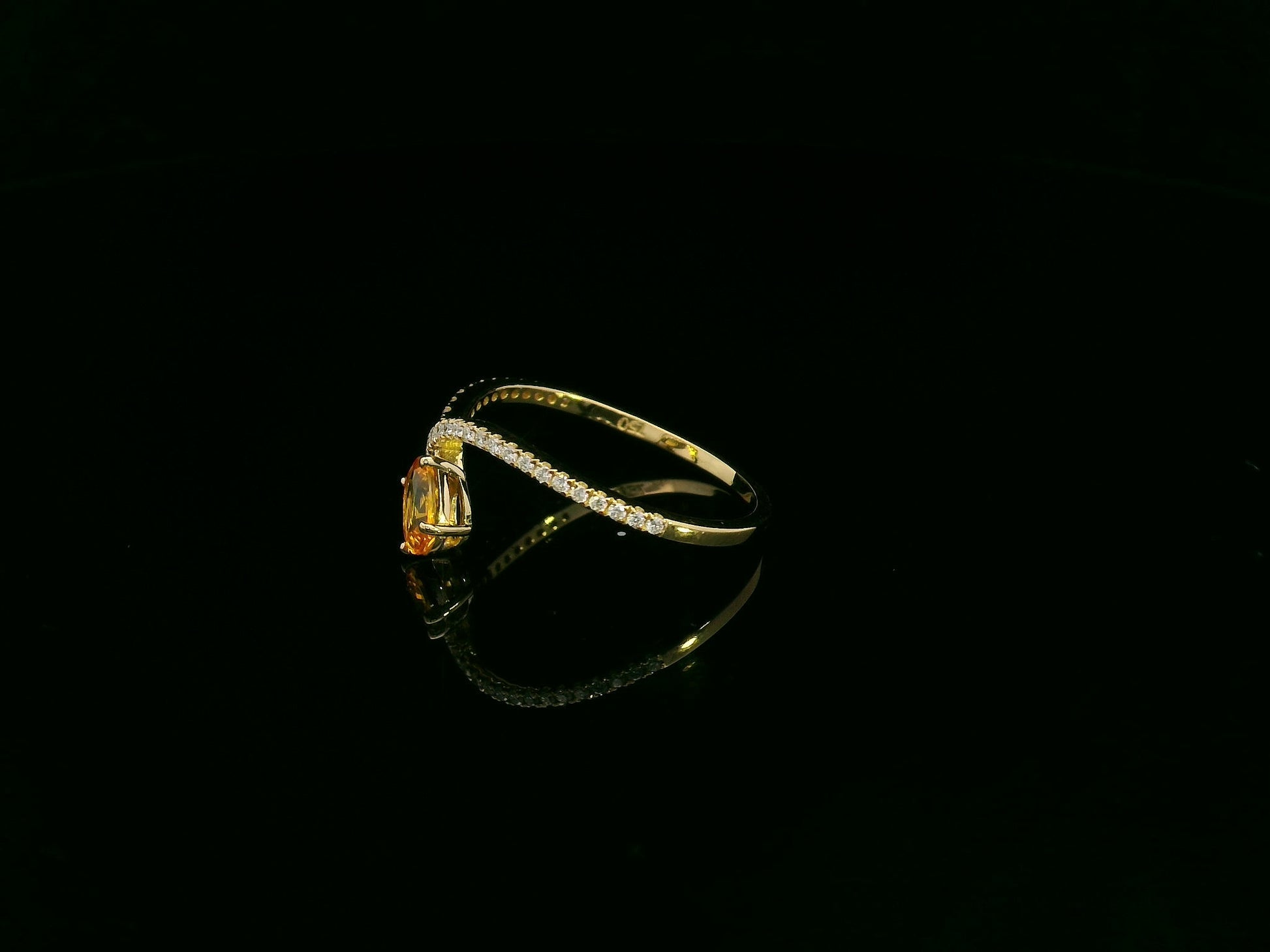 18K yellow gold oval yellow sapphire and diamond bypass statement ring by Emirates Diamonds