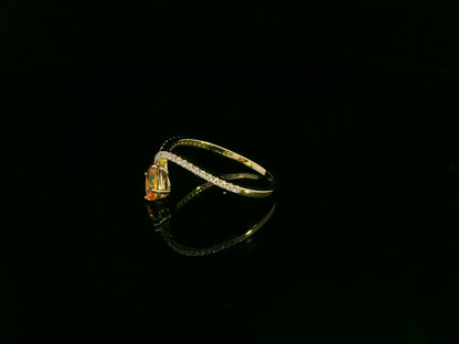 18K yellow gold oval yellow sapphire and diamond bypass statement ring by Emirates Diamonds