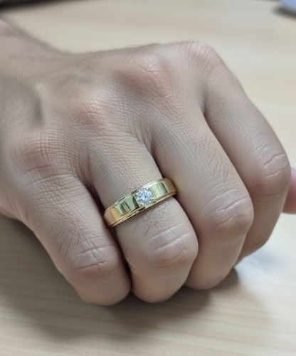 0.25 carat men’s diamond ring in 18K yellow gold by Emirates Diamonds featuring round brilliant diamond in structured band.