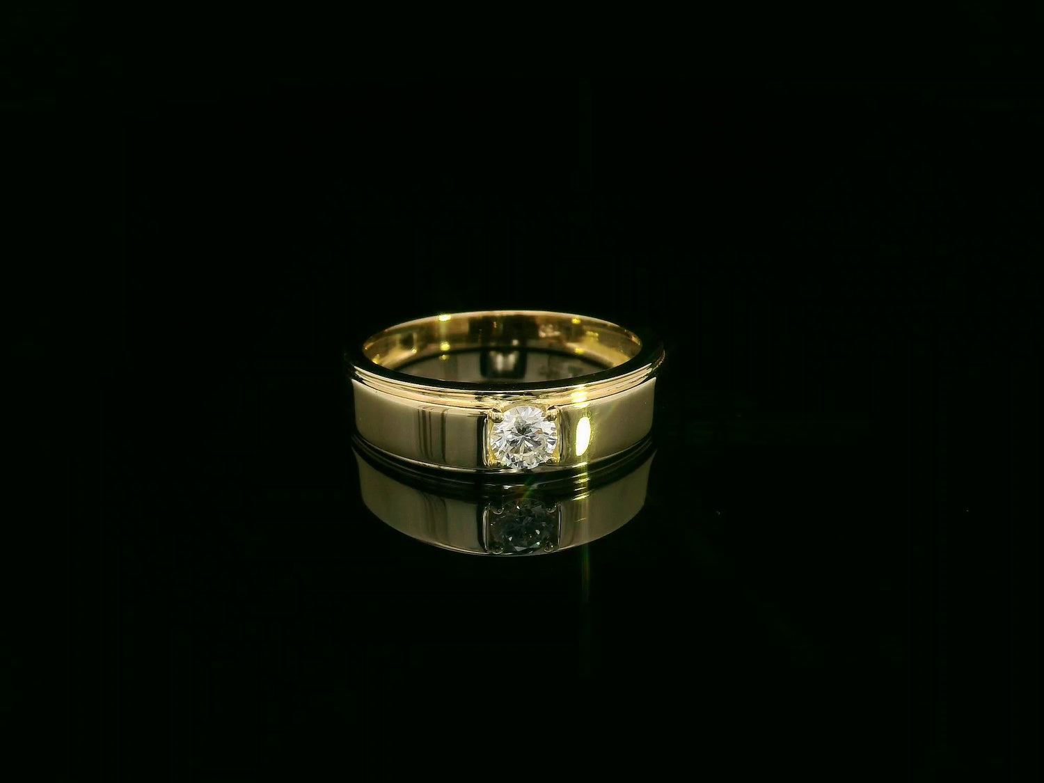 0.25 carat men’s diamond ring in 18K yellow gold by Emirates Diamonds featuring round brilliant diamond in structured band.