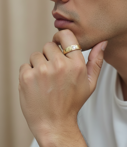 0.25 carat men’s diamond ring in 18K yellow gold by Emirates Diamonds featuring round brilliant diamond in structured band.