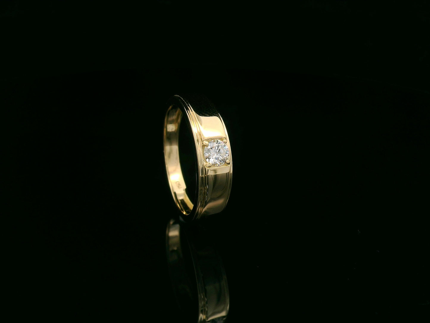 0.25 carat men’s diamond ring in 18K yellow gold by Emirates Diamonds featuring round brilliant diamond in structured band.