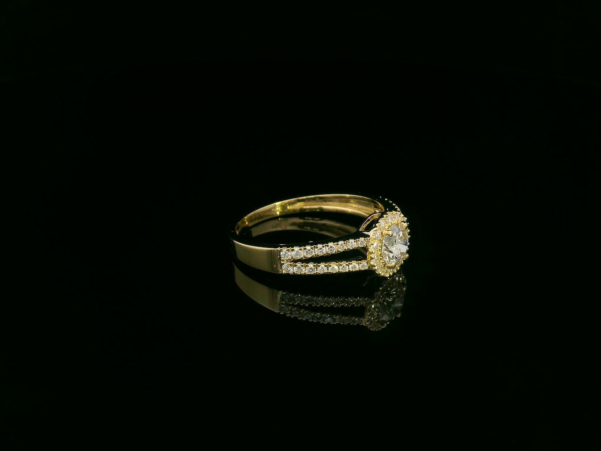 0.75 carat round diamond halo ring in 18K yellow gold with split diamond band by Emirates Diamonds