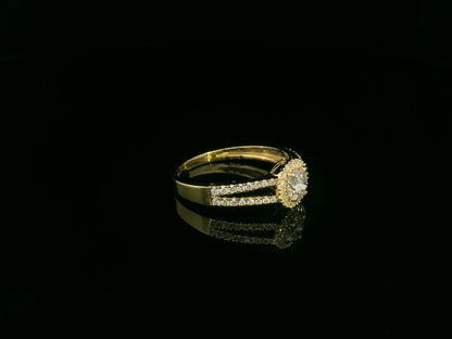 0.75 carat round diamond halo ring in 18K yellow gold with split diamond band by Emirates Diamonds