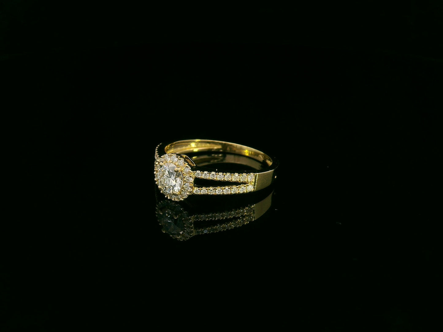 0.75 carat round diamond halo ring in 18K yellow gold with split diamond band by Emirates Diamonds