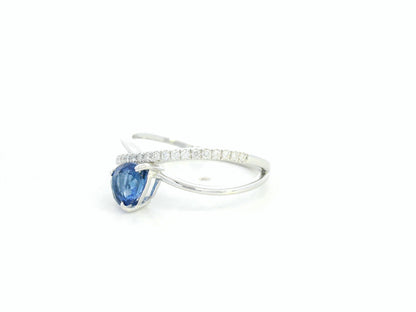 1.01 carat pear shaped blue sapphire and diamond crossover ring in 18K white gold by Emirates Diamonds