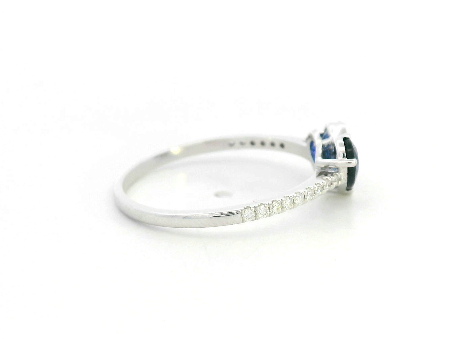 18K white gold  heart ring featuring two blue sapphires totaling 1.08 carat with 0.10 carat diamond accents by Emirates Diamonds.