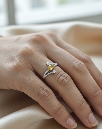 18K white gold ring featuring 0.68 carat oval yellow sapphire with 0.26 carat diamond split band design by Emirates Diamonds.