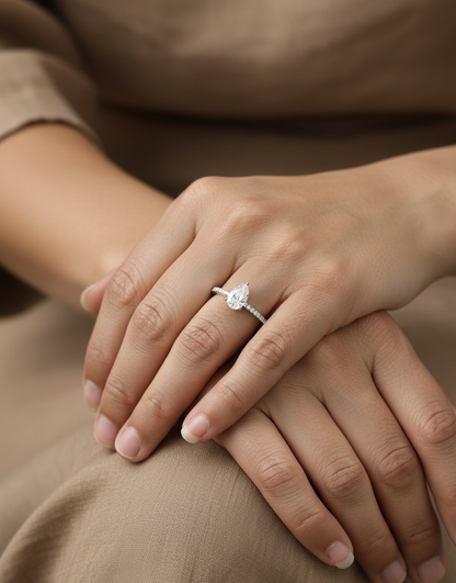 1.01 carat GIA certified pear diamond engagement ring in 18K white gold with pavé band by Emirates Diamonds Dubai