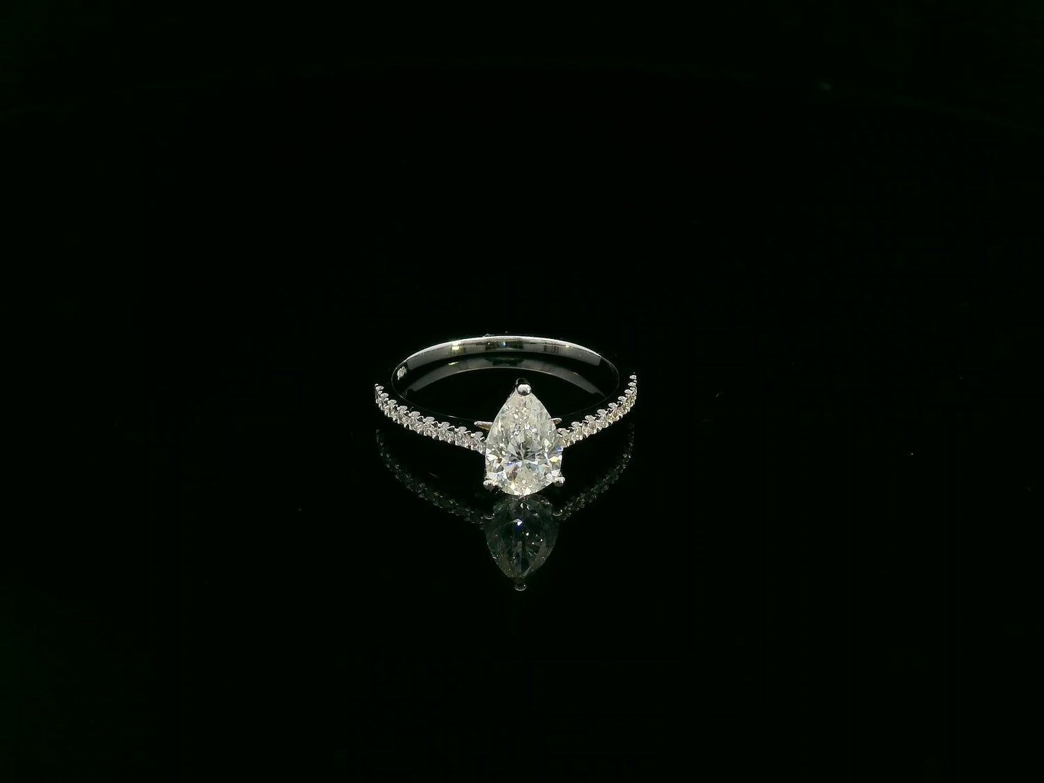 1.01 carat GIA certified pear diamond engagement ring in 18K white gold with pavé band by Emirates Diamonds Dubai