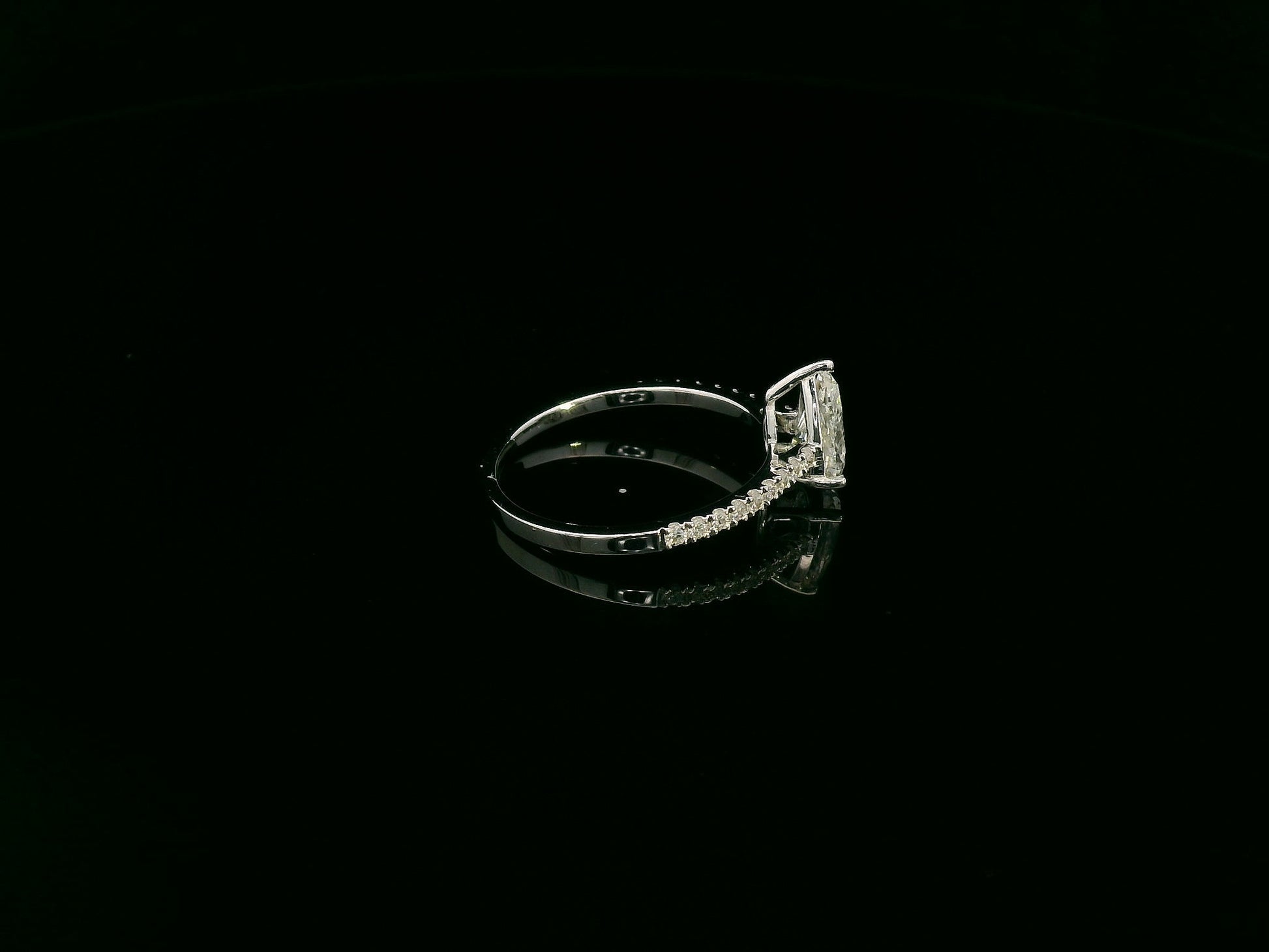 1.01 carat GIA certified pear diamond engagement ring in 18K white gold with pavé band by Emirates Diamonds Dubai