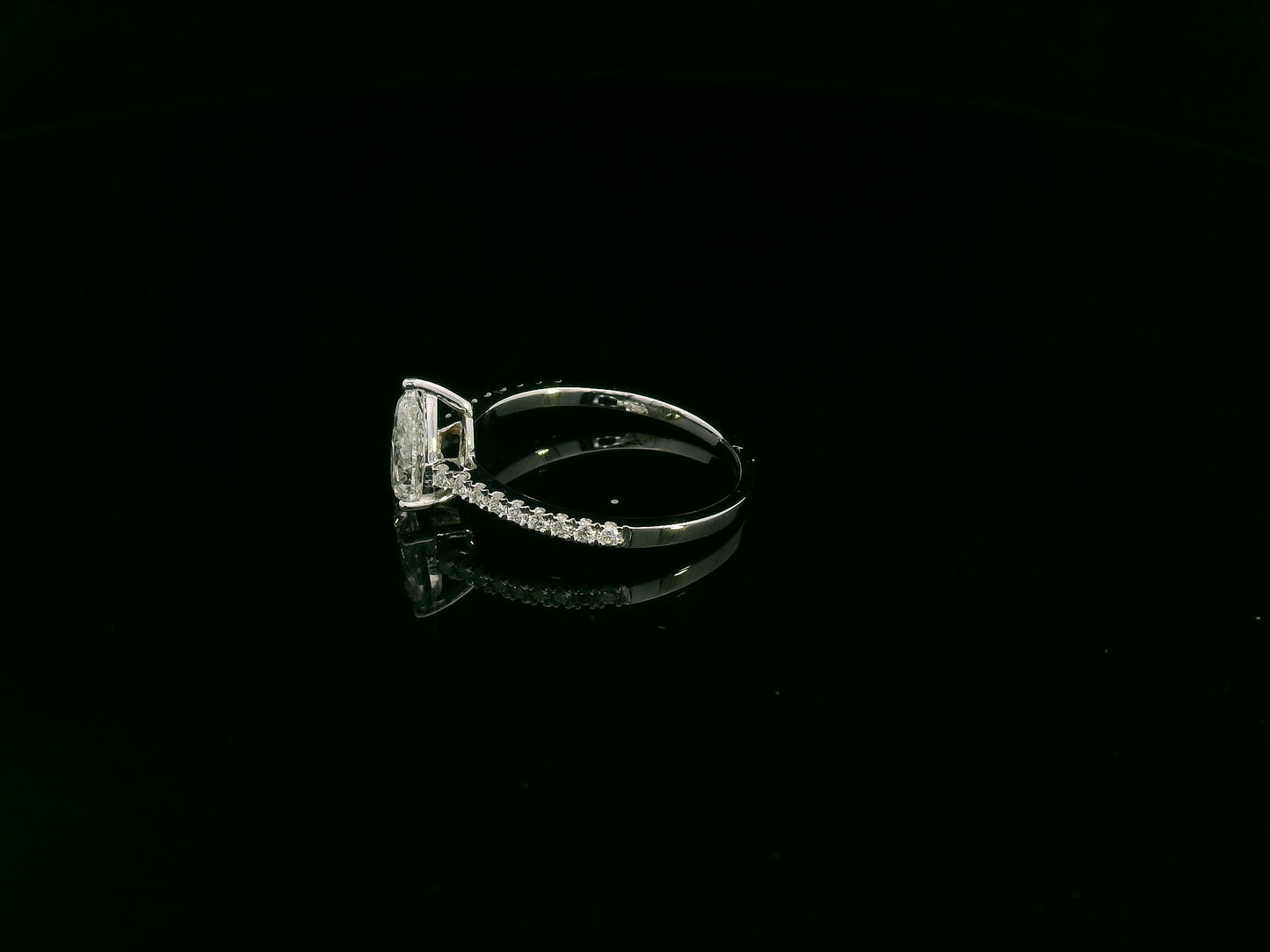 1.01 carat GIA certified pear diamond engagement ring in 18K white gold with pavé band by Emirates Diamonds Dubai