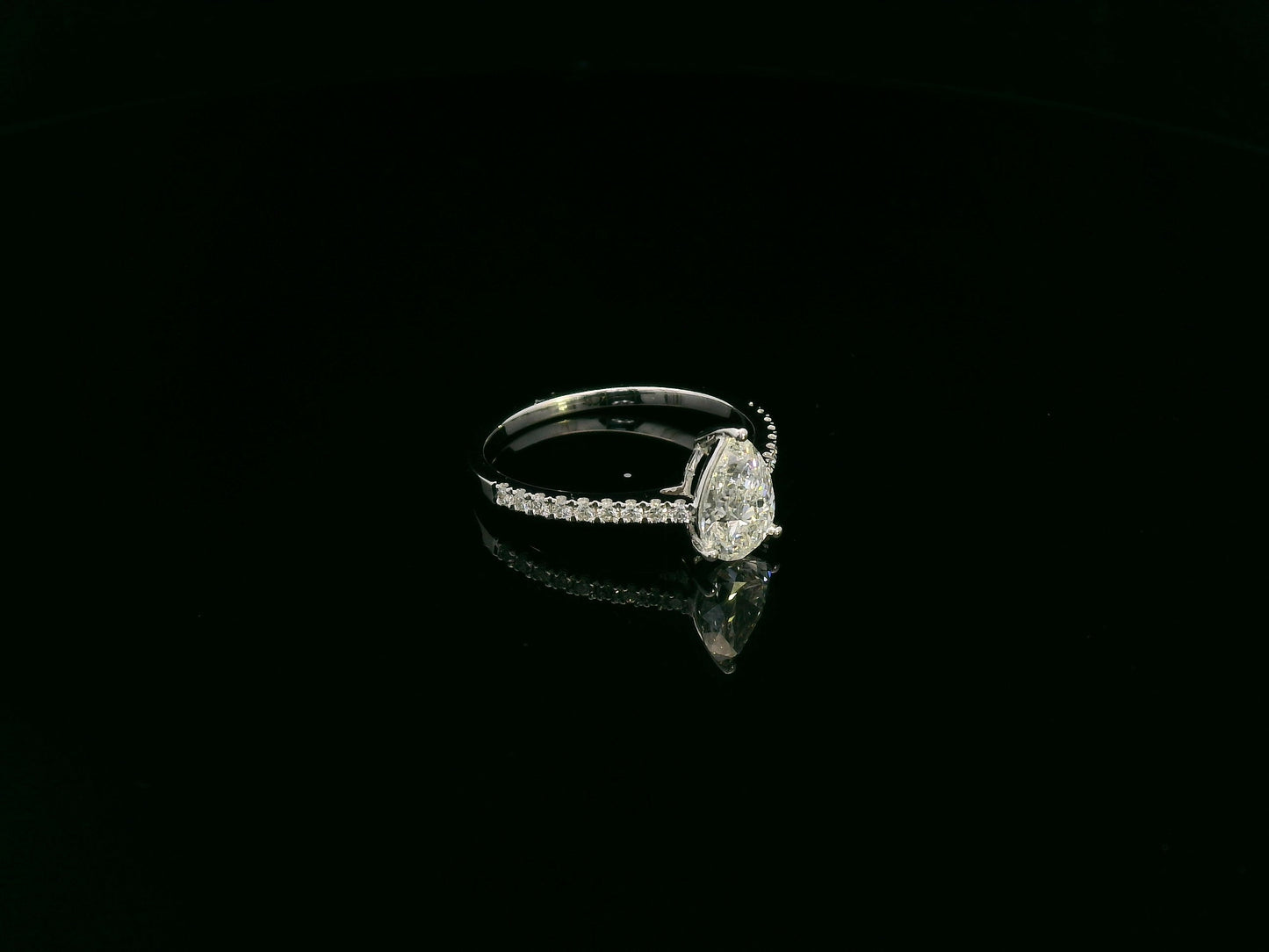 1.01 carat GIA certified pear diamond engagement ring in 18K white gold with pavé band by Emirates Diamonds Dubai