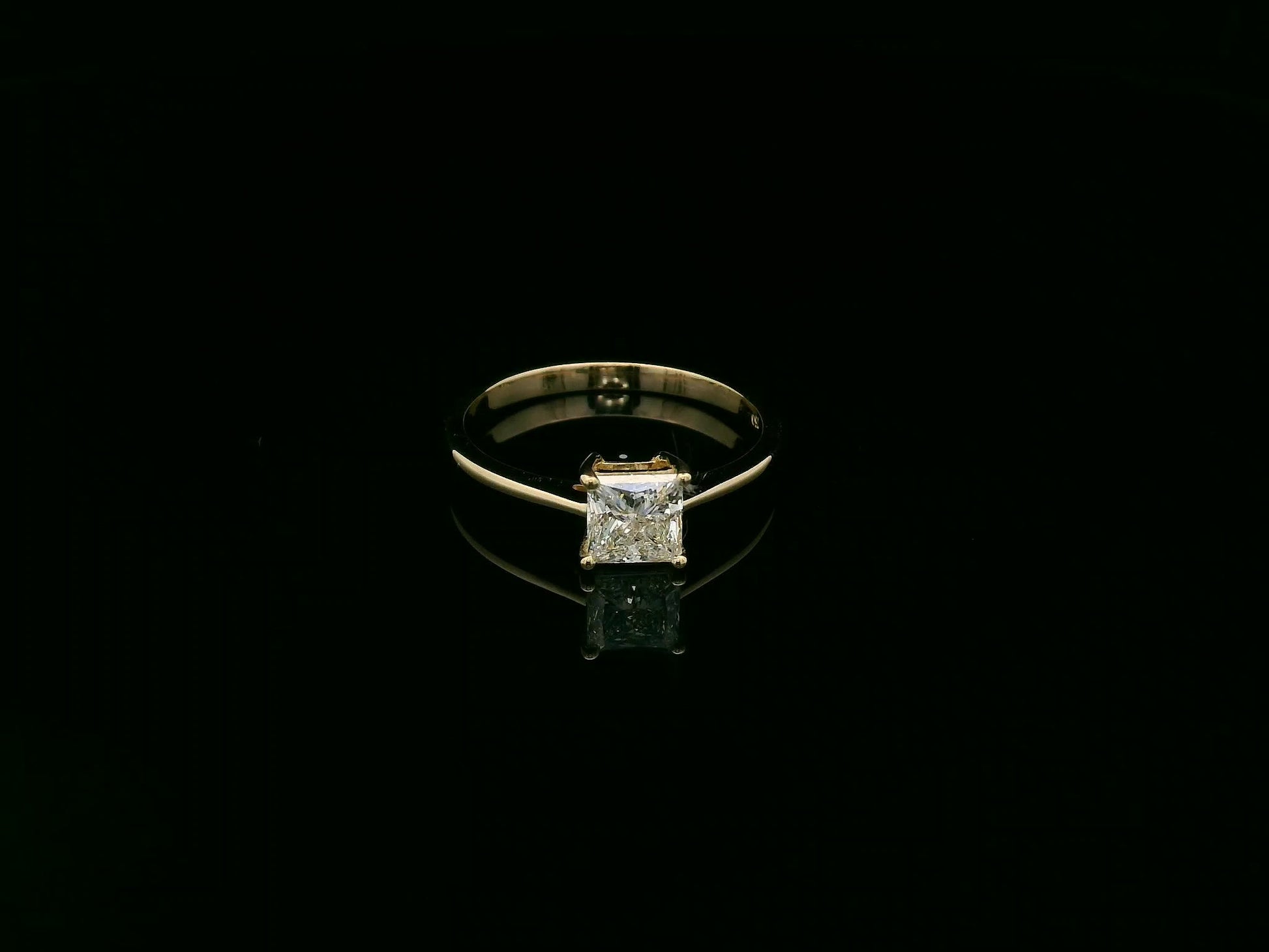 Princess cut diamond solitaire ring in 18K yellow gold by Emirates Diamonds