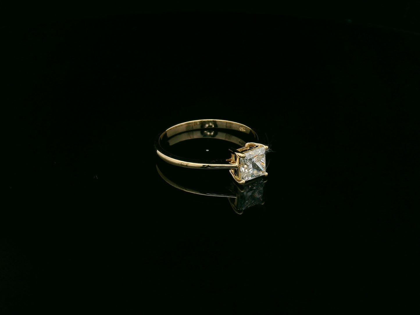 Princess cut diamond solitaire ring in 18K yellow gold by Emirates Diamonds