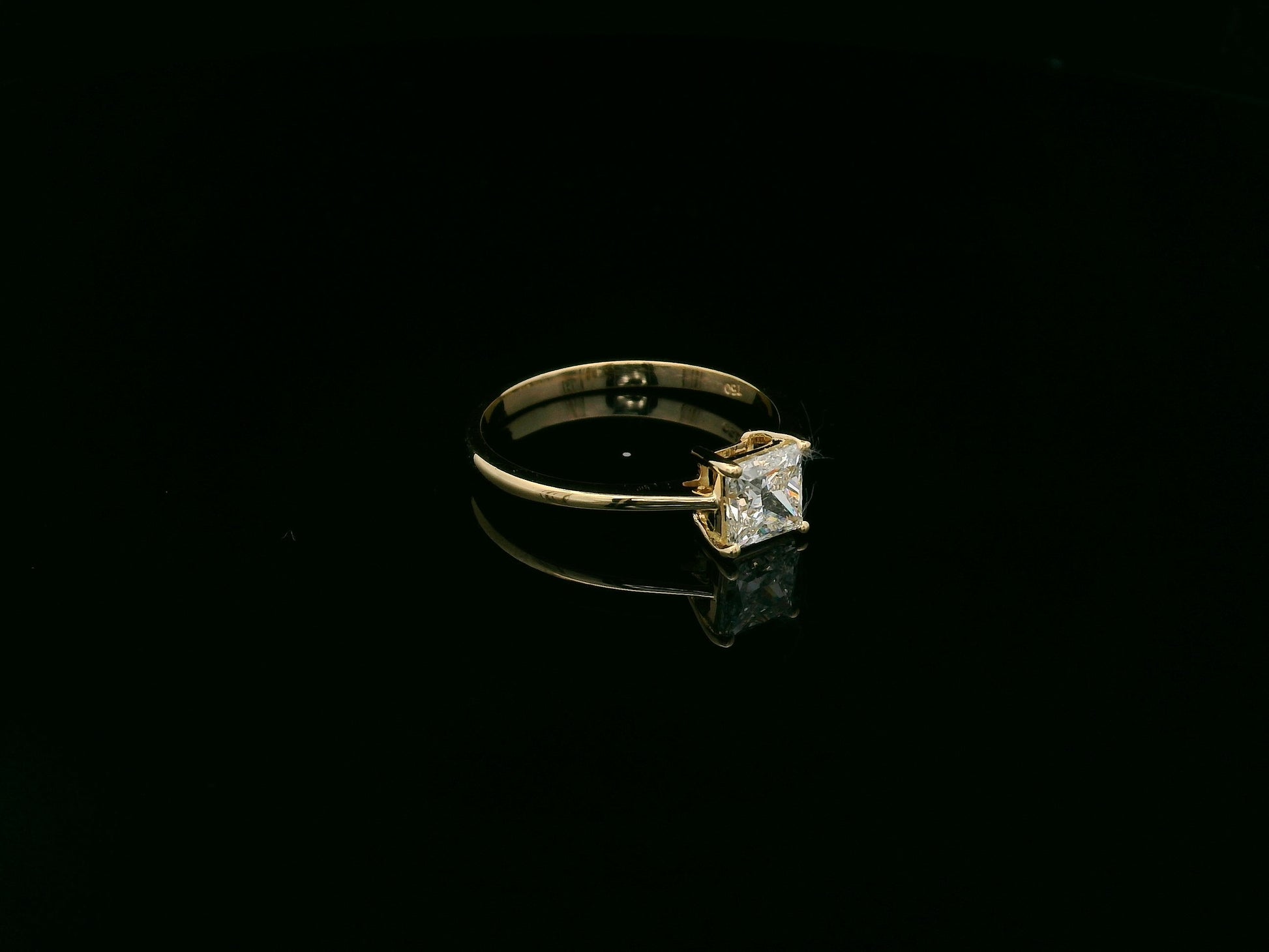 Princess cut diamond solitaire ring in 18K yellow gold by Emirates Diamonds