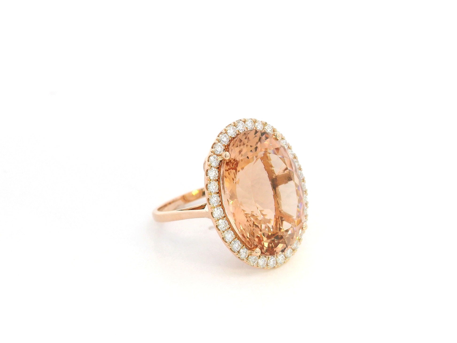 20.67 carat oval morganite diamond halo ring in 18K rose gold by Emirates Diamonds