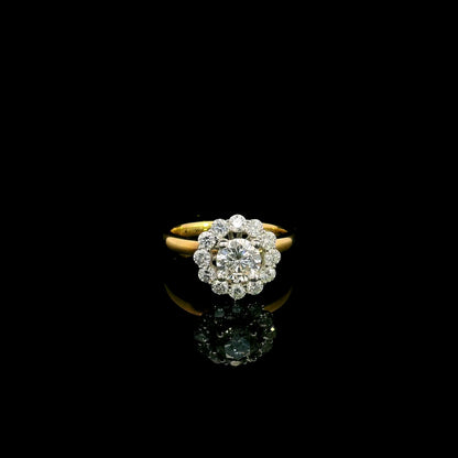 Natural diamond halo engagement ring in solid 18K yellow gold featuring a 0.70 carat IGI certified round brilliant centre diamond surrounded by 0.51 carat natural diamonds.