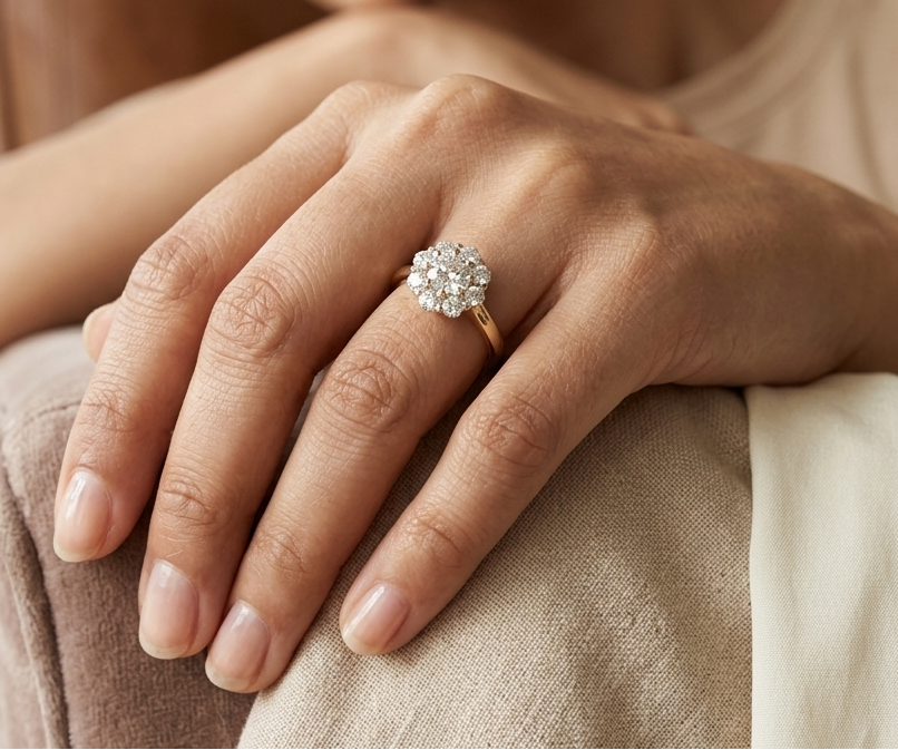 Natural diamond halo engagement ring in solid 18K yellow gold featuring a 0.70 carat IGI certified round brilliant centre diamond surrounded by 0.51 carat natural diamonds.