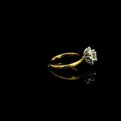 Natural diamond halo engagement ring in solid 18K yellow gold featuring a 0.70 carat IGI certified round brilliant centre diamond surrounded by 0.51 carat natural diamonds.
