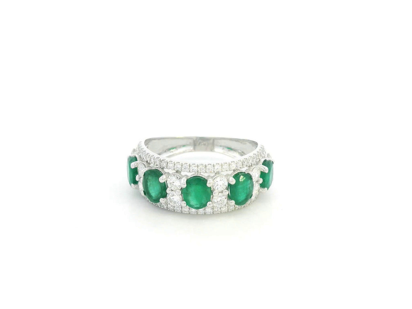 Emerald and diamond five-stone ring in 18K white gold with accents by Emirates Diamonds.