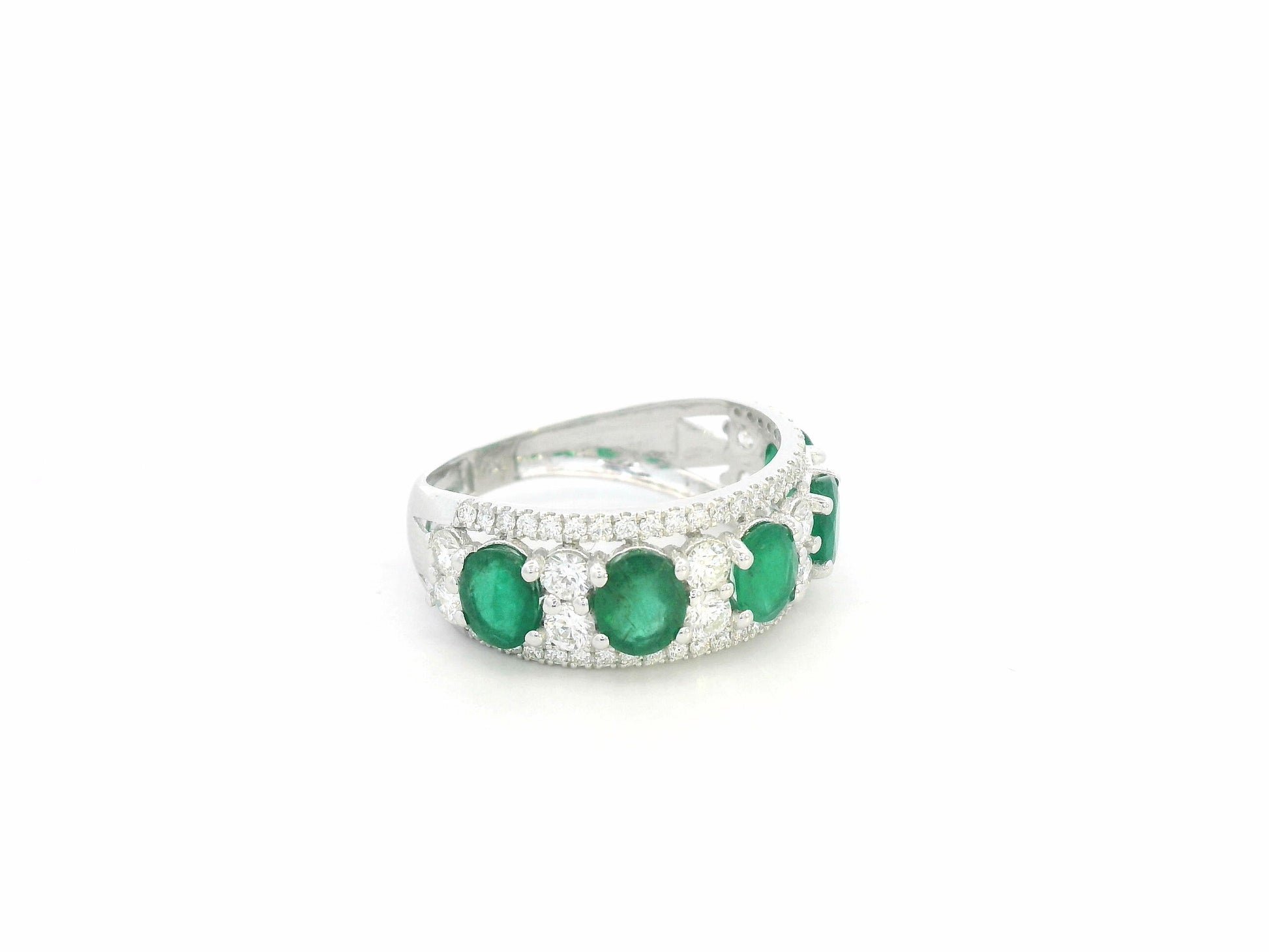 Emerald and diamond five-stone ring in 18K white gold with accents by Emirates Diamonds.