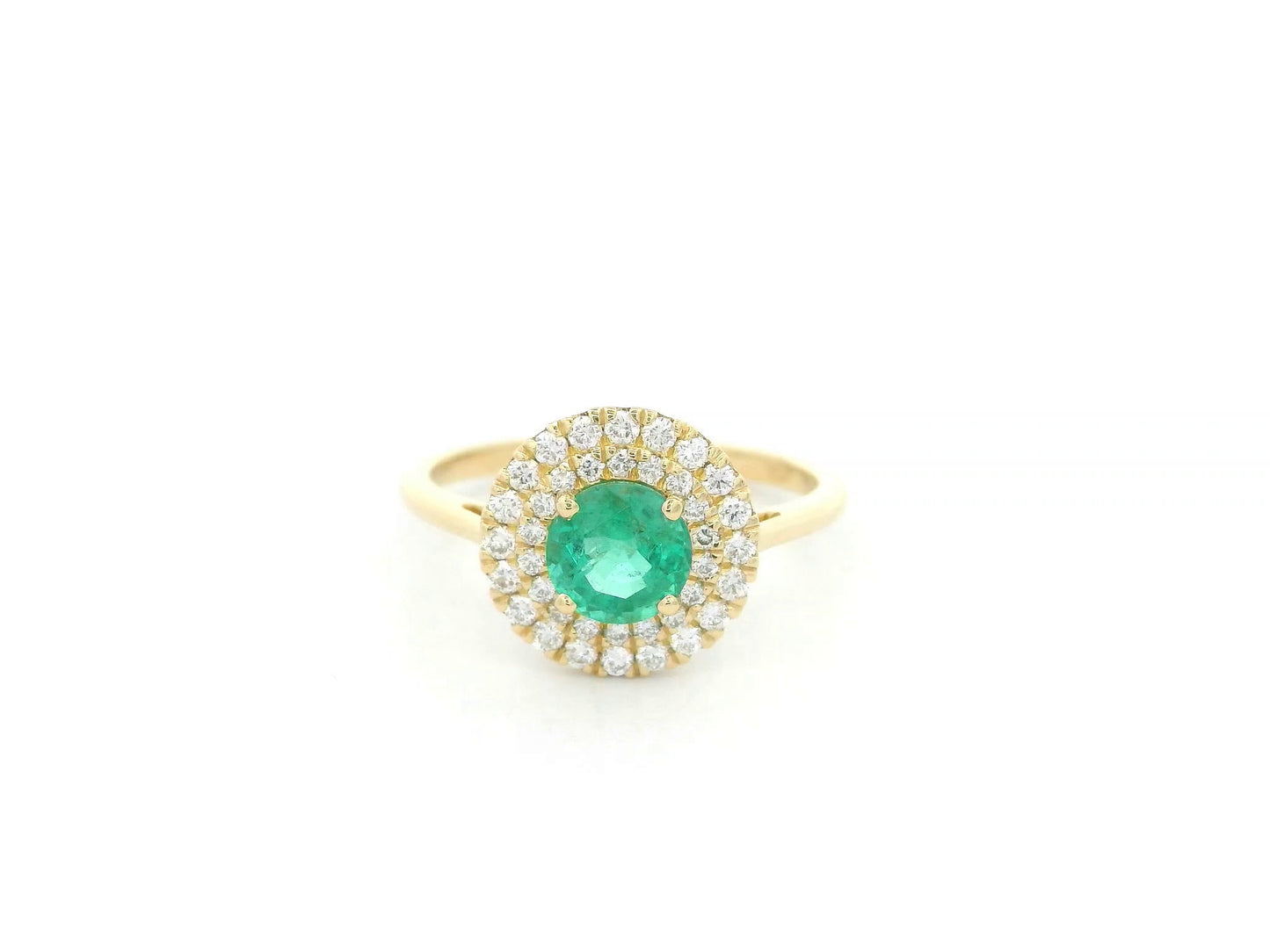 18K yellow gold emerald and diamond halo ring with round emerald center, luxury fine jewelry by Emirates Diamonds.