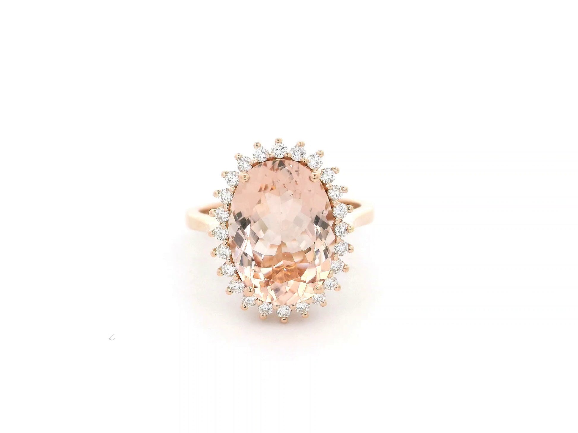 18K rose gold morganite and diamond halo ring featuring an oval morganite and sparkling diamond accents by Emirates Diamonds.