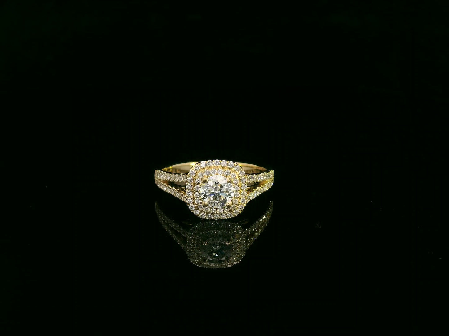 0.56 carat IGI certified diamond halo engagement ring in 18K yellow gold with split shank by Emirates Diamonds