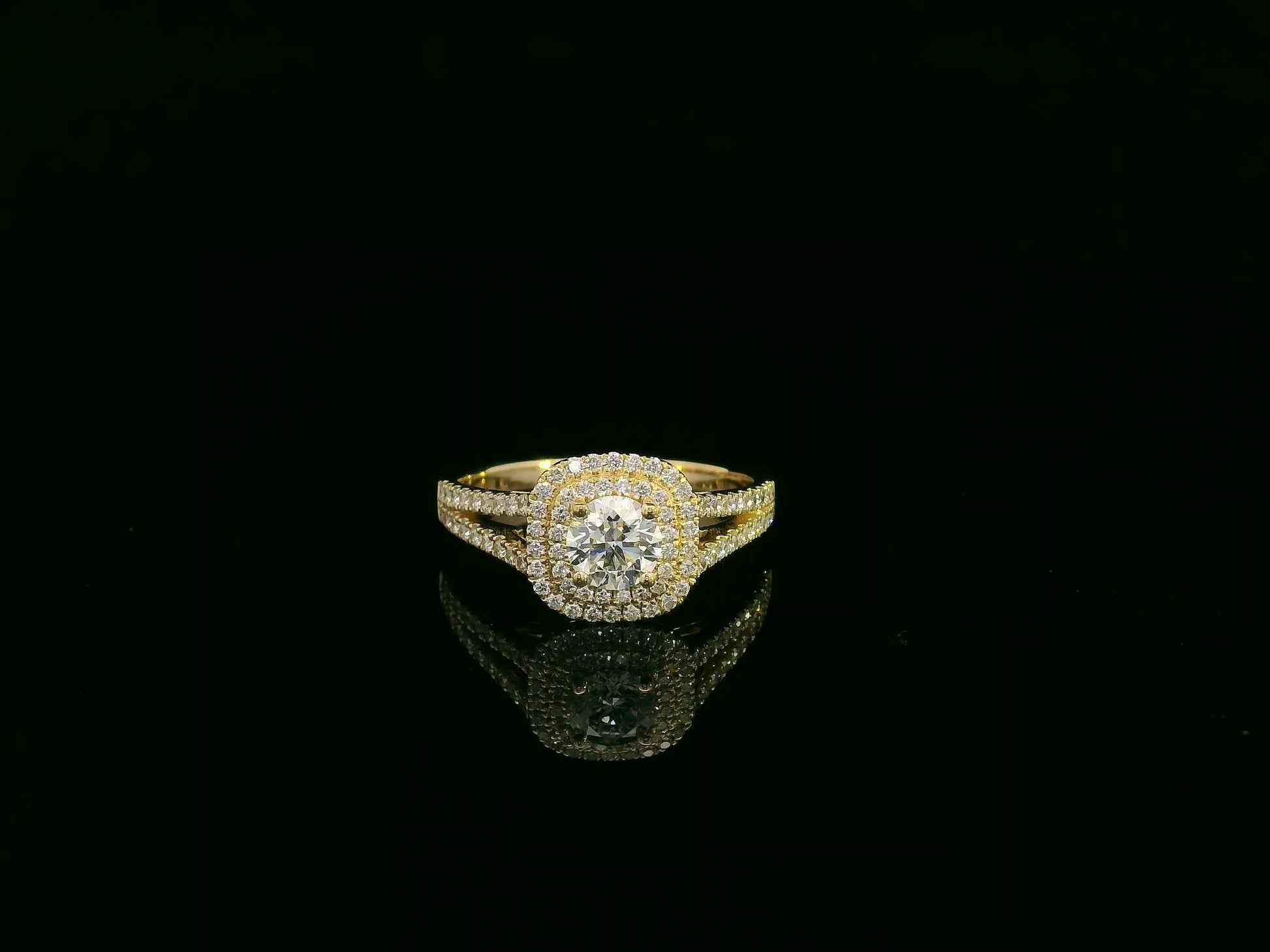0.56 carat IGI certified diamond halo engagement ring in 18K yellow gold with split shank by Emirates Diamonds