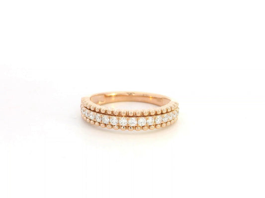 18K rose gold diamond eternity band ring with 0.35 carat round diamonds, minimal stacking wedding band by Emirates Diamonds.